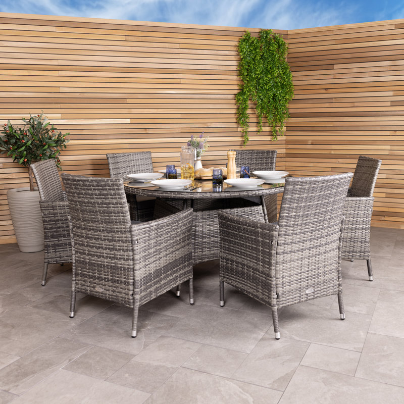 Jeneva 6 - Person Wicker Patio Dining Set with Round Table , Cushions Included, Grey