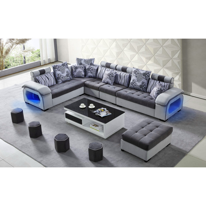 Canapé modulaire réversible en microfibre avec repose-pieds Marleine