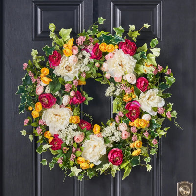 Couronne de pivoines blanche et fuchsia avec renoncule jaune et rose