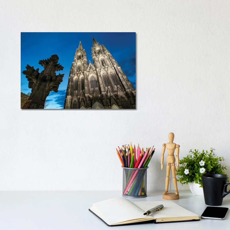 Kreuzblume In Front Of The Cologne Cathedral, North Rhine-Westphalia, Germany by Jan Becke - Wrapped Canvas Print