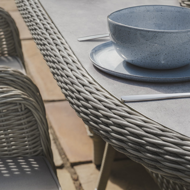 Anissah 6 - Person Patio Dining Set with Oval Table