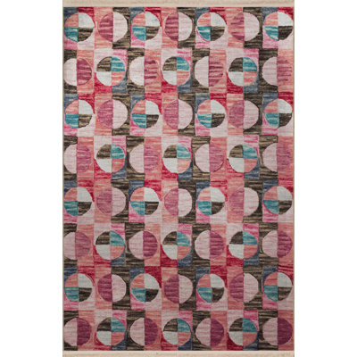 Tapis décoratif rose multicolore à motif géométrique et à franges