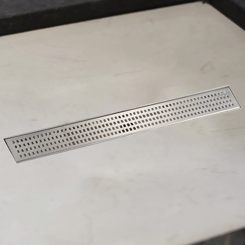 Drain de douche à grille linéaire avec pieds niveleurs en nickel brossé