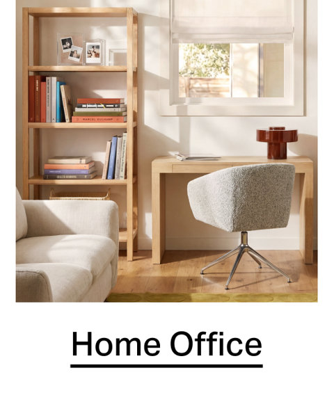 Home Office featuring a wooden desk, a swivel chair with textured upholstery, and a tall wooden bookcase filled with books.
