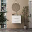 Le meuble-lavabo mural 24 po avec deux tiroirs, système de fermeture en douceur, lavabo en céramique, crée un espace de salle de bain moderne et minimaliste