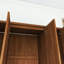 Armoire penderie en bois brun avec tiroirs-1117050676