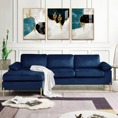 Canapé d'angle en velours bleu avec méridienne, structure en bois massif sur pattes en métal fini doré, accoudoirs rembourrés, coussins d'assise et de dossier amovibles garnis de mousse, largeur 253 cm, profondeur 133 cm, hauteur 86 cm