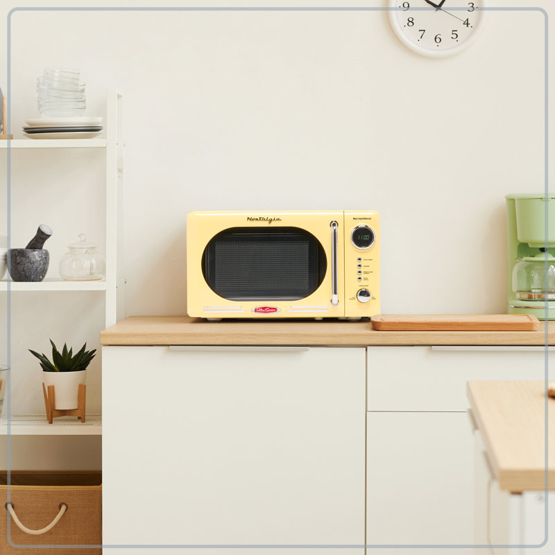 Nostalgia Retro 0.7 Cubic Foot 700-watt Countertop Microwave Oven, Yellow