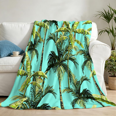 Jeté en flanelle verte molletonnée, imprimé floral