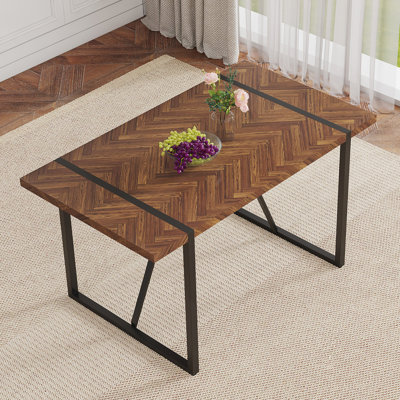 A Minimalist Retro Rectangular Dining Table With A Specially Textured Top And Black Metal Legs