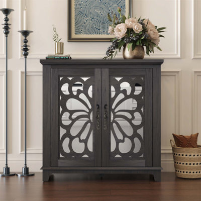 Élégant buffet avec 2 portes en miroir en acrylique, un rangement spacieux et un accent sculpté creux, idéal pour la vie moderne et les espaces organisés.