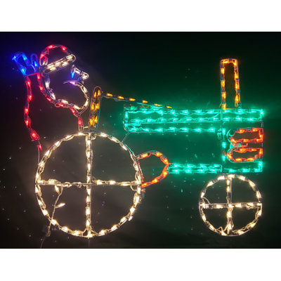 Père Noël sur un tracteur lumineux