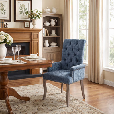 Fauteuil de salle à manger d'appoint élégant, capitonné, en tissu chenille, avec pieds en bois massif courbés.