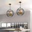 Luminaire suspendu sphère 4 lumières avec accents de cristal rappaport