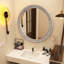 Miroir mural rond avec cadre sculpté