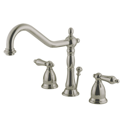 Kingston Brass Heritage Two-Handle 3-Hole Deck Mount Widespread Bathroom Faucet with Brass Pop-Up Drain