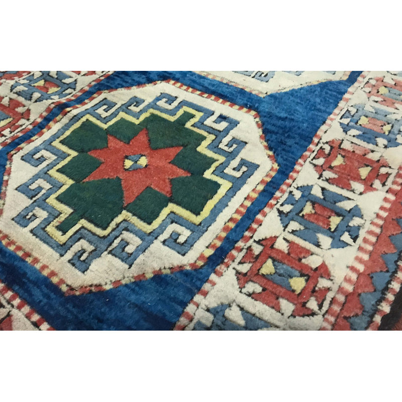 Tapis bleu et ivoire de haute qualité noué à la main
