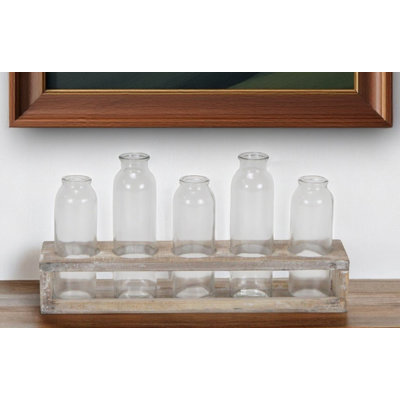Ensemble de cinq bouteilles décoratives en verre transparent