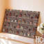 La toile crée un design de tissu richement texturé mettant en vedette un collage d'art mural aux motifs architecturaux indiens complexes, y compris un art mural sur toile arquée-1374362235
