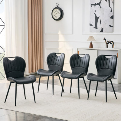 Ensemble de 4 chaises de salle à manger en polyuréthane noir avec poignée intégrée. Cadre en métal noir, pieds réglables. Chaises de salle à manger à domicile avec coussin confortable extra-large, polyvalent pour de multiples cas de figure.