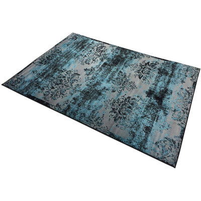 Tapis à motif damassé patiné