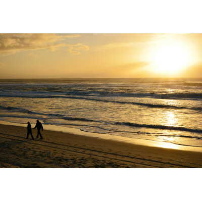 Beach walk elderly couple Wall Art on Canvas