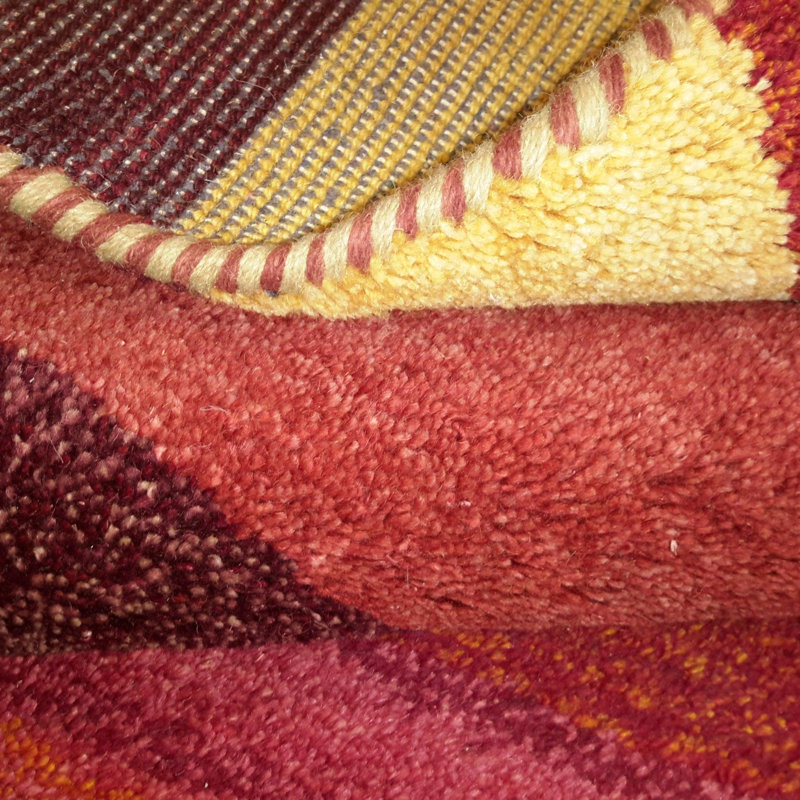 Noail Striped Area Rug in Red