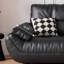 Causeuse-coussin modulable noire en cuir véritable