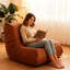 Fauteuil confortable orange avec boutons, mousse à mémoire de forme douce, assise coulissante, rembourrage en mousse