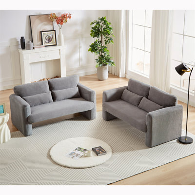Canapé confortable en velours côtelé avec coussins de soutien et design élégant