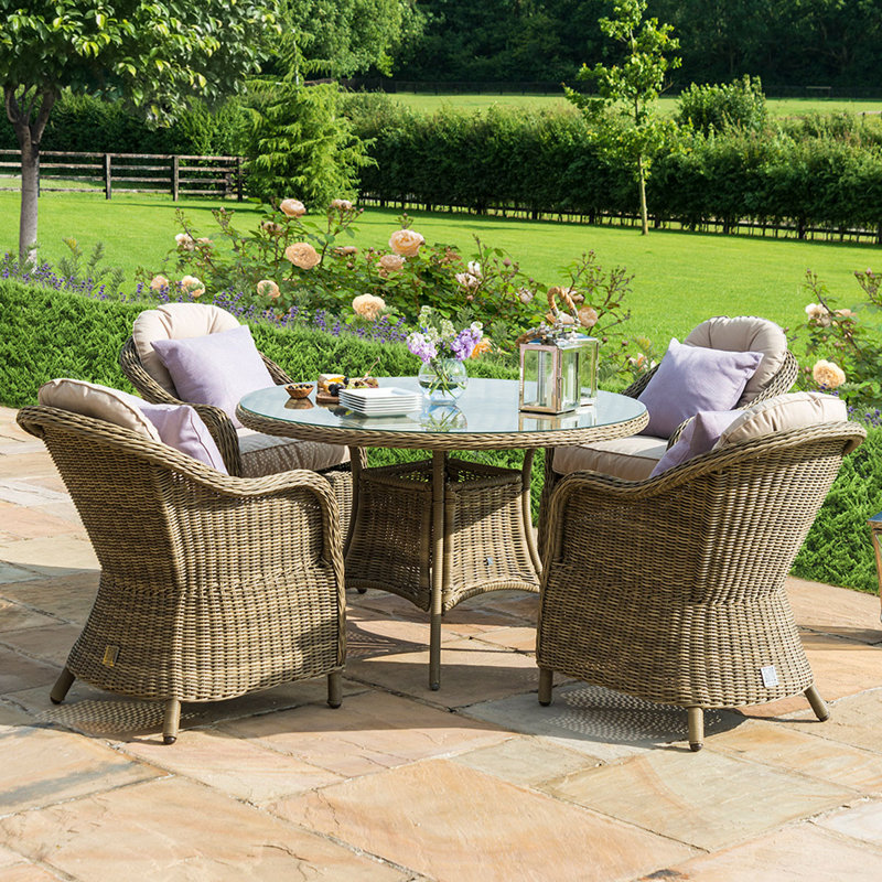 Danterius 4 - Person Patio Dining Set Round Table with Cushions Included