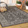 Markwart Vine and Border Textured Weave Black/Gray Indoor/Outdoor Rug