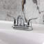 Robinet de salle de bain central à 4 poignées à 4 trous à fixation sur le comptoir avec robinet escamotable en plastique Kingston Brass Yosemite-13612059