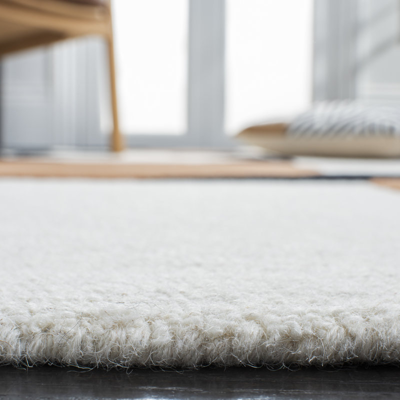 Antoni Handmade Wool Ivory/Black/Brown Rug, Rectangle 5' x 8'