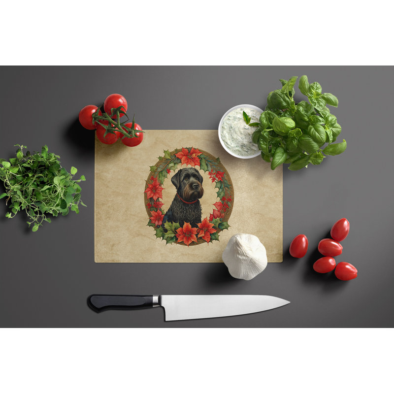 Planche à découper en verre noir avec fleurs de Noël et terrier russe