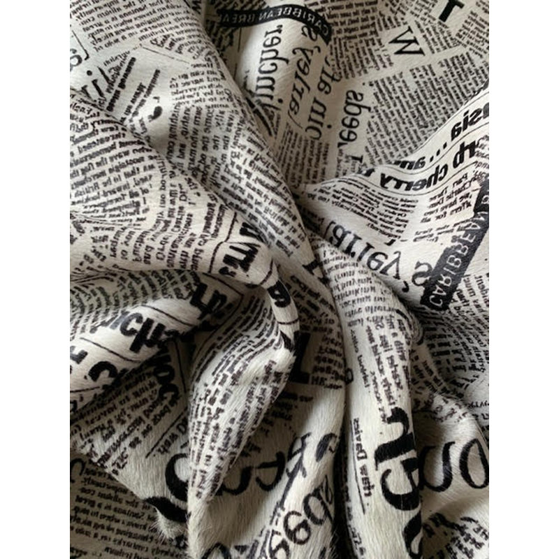 Newspaper Print Cowhide Rug