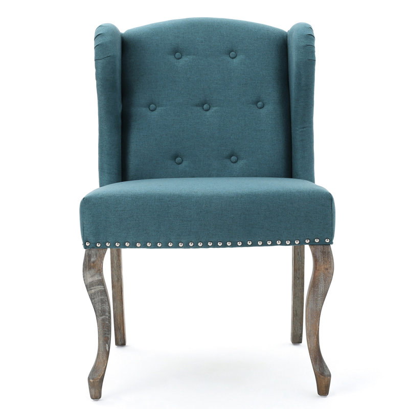 Fauteuil à oreilles classique bleu sarcelle avec boutons et clous capitonnés