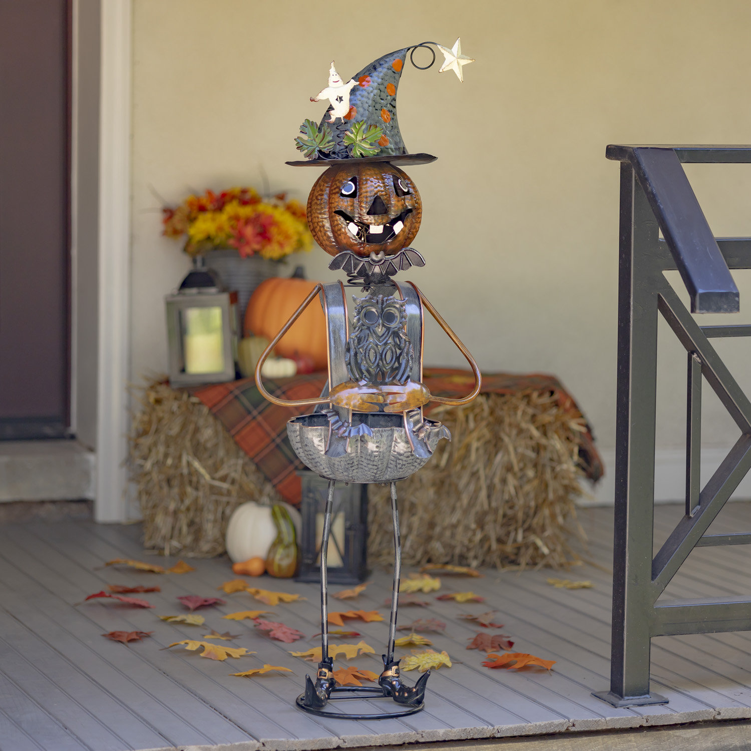 https://assets.wfcdn.com/im/49551860/compr-r85/2162/216239852/pumpkin-witch-with-owl-candy-holder-figurine.jpg