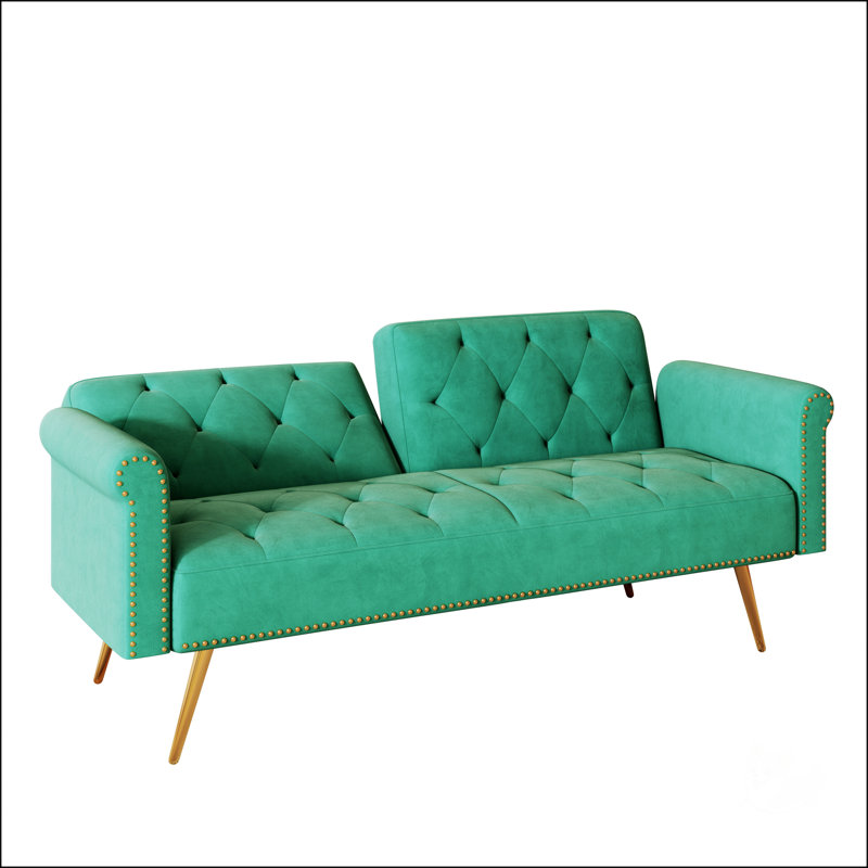 Luxueux canapé-lit en velours vert avec garniture cloutée et coussin décoratif assorti pour un confort élégant