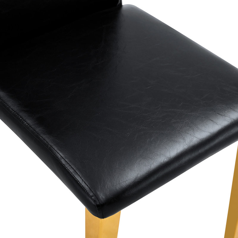 4 chaises de salle à manger en polyuréthane noir avec des pieds en métal doré - des pieds confortables et élégants, confortables