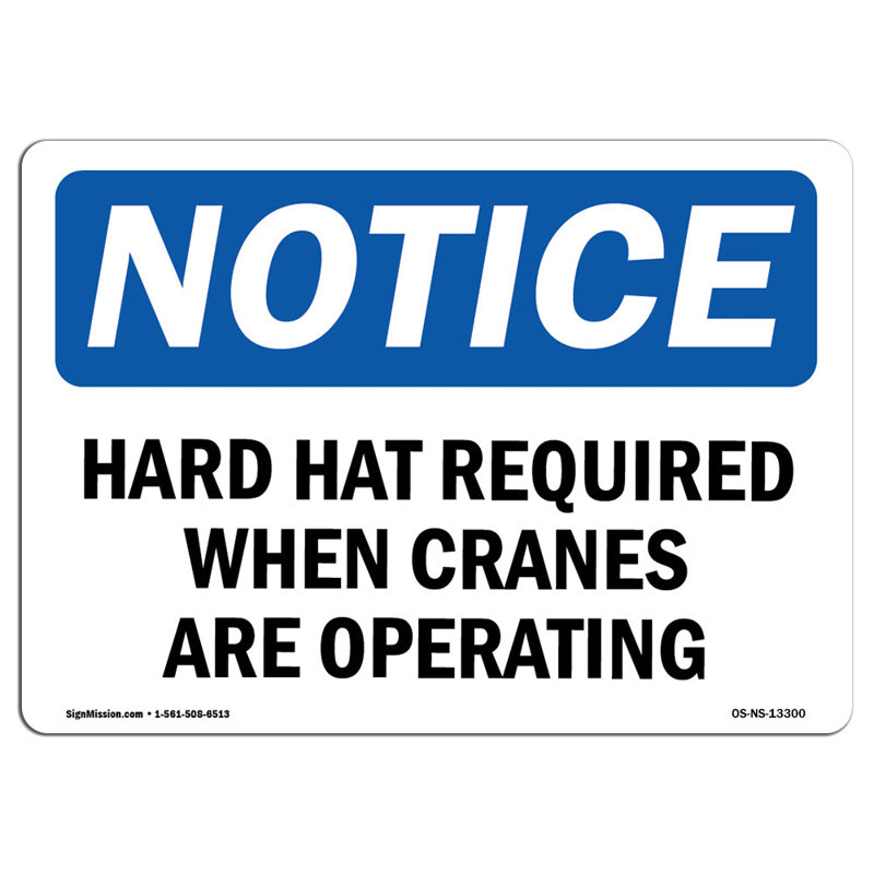 Remarquez que les casques de protection sont requis lorsque les grues fonctionnent