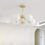 Lustre 5 têtes à finition dorée
