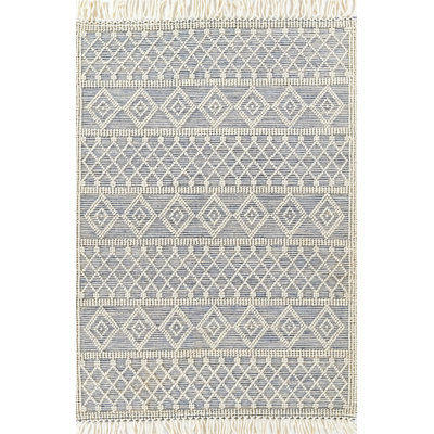 Tapis géométrique beige / bleu en laine tissé à la main Alyson