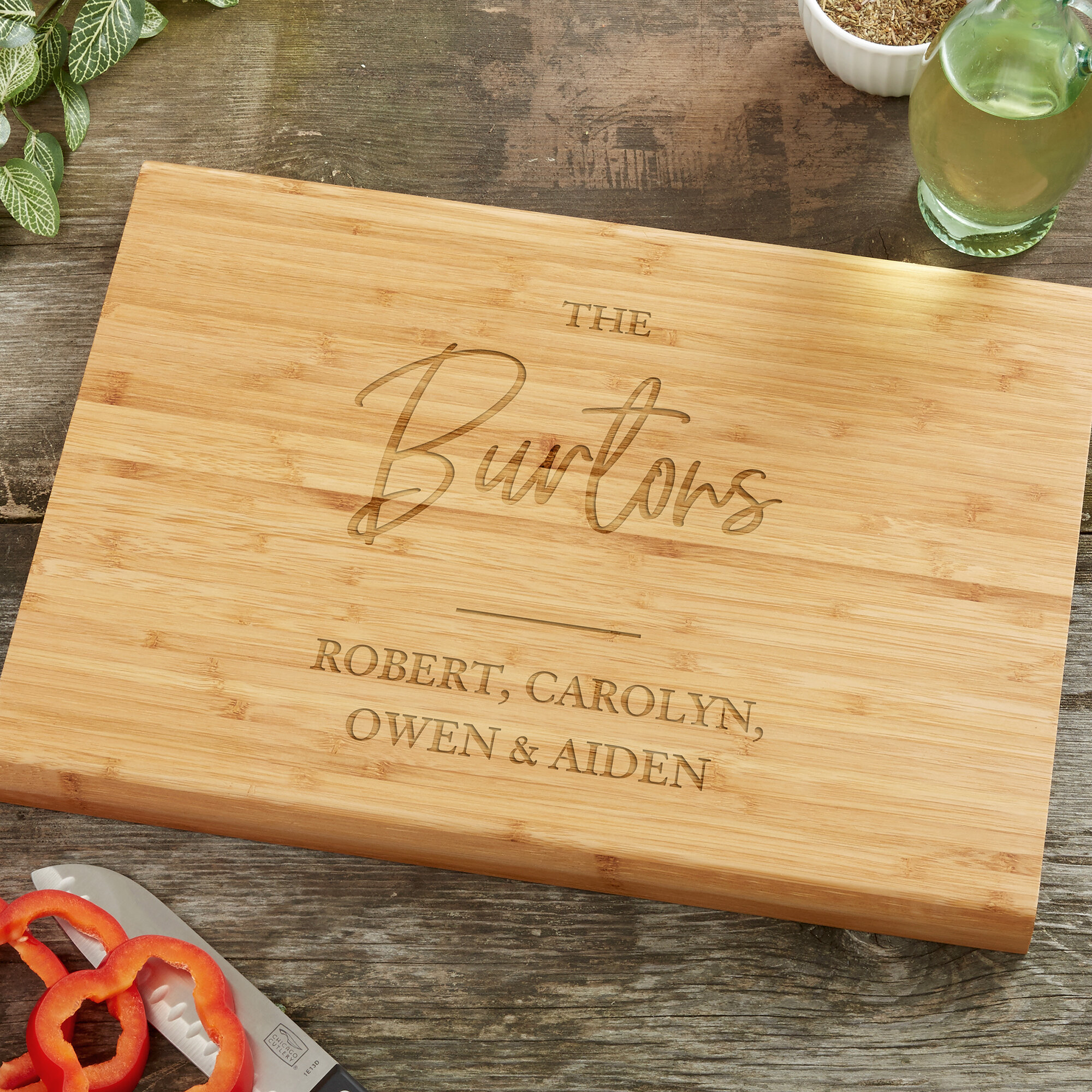https://assets.wfcdn.com/im/49607999/compr-r85/1583/158381867/classic-elegance-family-personalized-bamboo-cutting-board.jpg