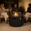 Table basse d'extérieur ronde au propane de 89,3 cm (35,19 po), 50 000 BTU, aspect bois, avec compartiment dissimulé pour la bouteille de propane.