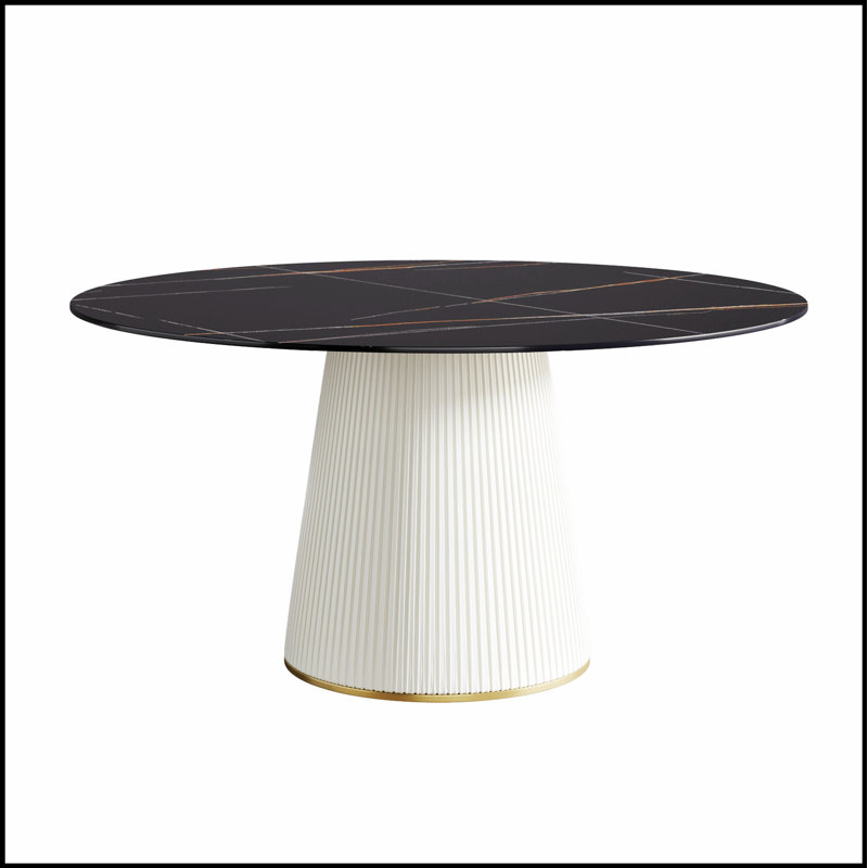 Table de salle à manger ronde moderne en pierre artificielle noire avec base en polyuréthane beige, pouvant accueillir 6 personnes pour des repas et des rassemblements élégants.