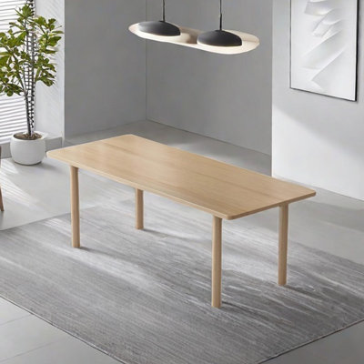 The long solid wood dining table is very simple