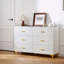 Commode 6 tiroirs blanche avec poignées dorées et pieds en métal