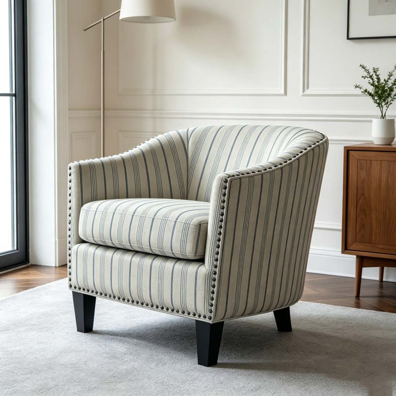 Fauteuil demi-tonneau rembourré à rayures