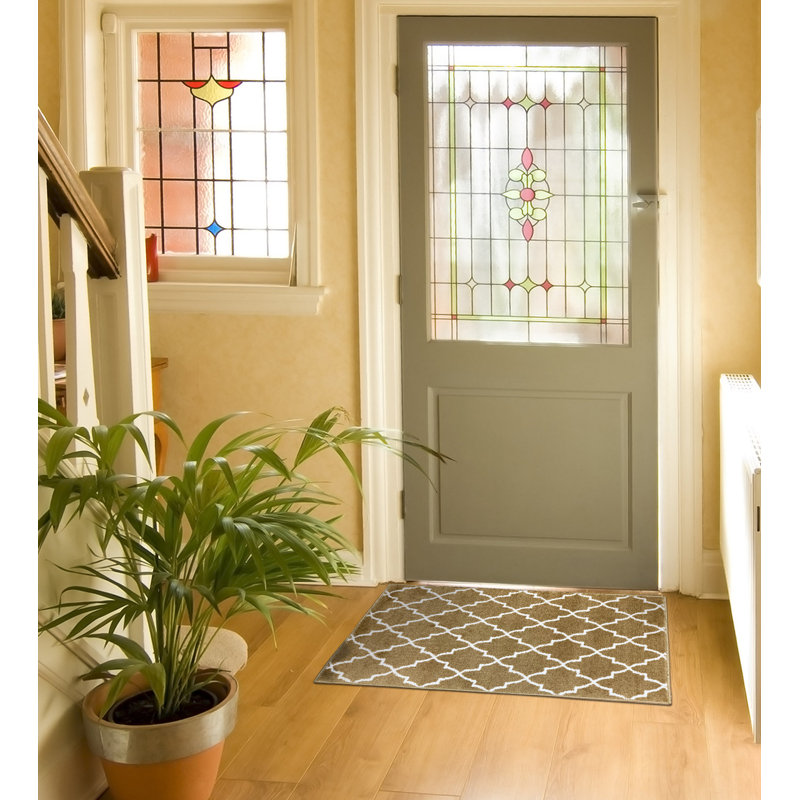 Spiceland Floral Polypropylene Area Rug in Beige